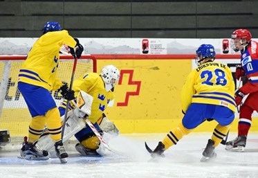 LUCERNE, SWITZERLAND - APRIL 21: Russia's Mikhail Vorobyov #10 scores a first period goal against Sweden's Daniel Marmenlind #1 while Joel Eriksson Ek #28 and Oliver Kylington #6 look on during preliminary round action at the 2015 IIHF Ice Hockey U18 World Championship. (Photo by Matt Zambonin/HHOF-IIHF Images)

